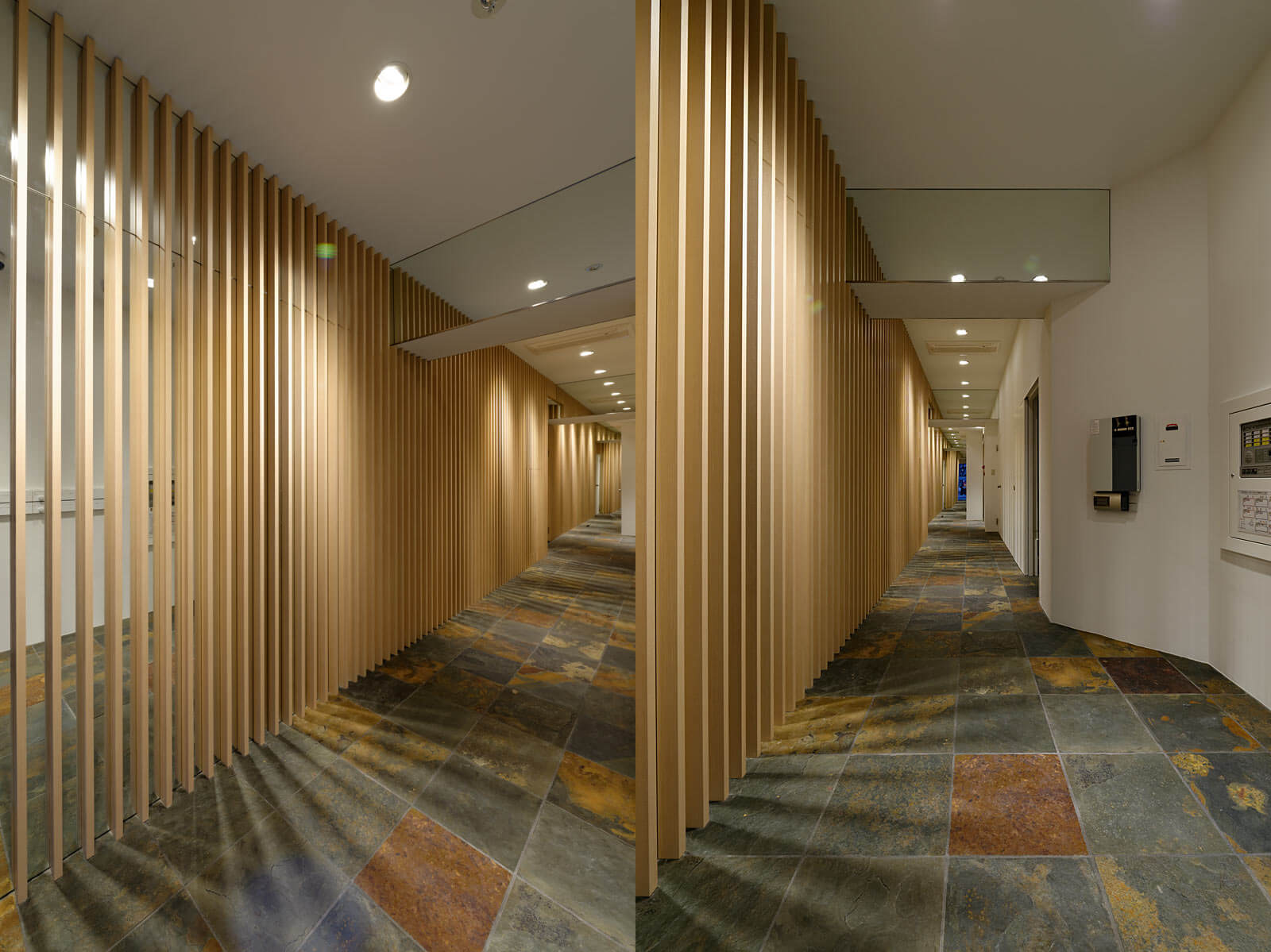 格子と鏡が作る奥行きのあるアプローチ|River Side Office